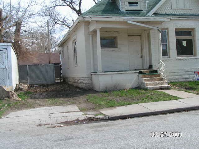 The front of a white brick house.